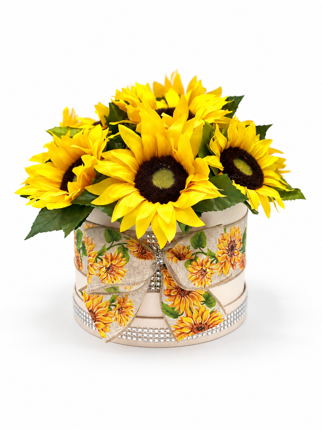 Yellow sunflowers in a cream hat box with a sunflower bow and natural shadow