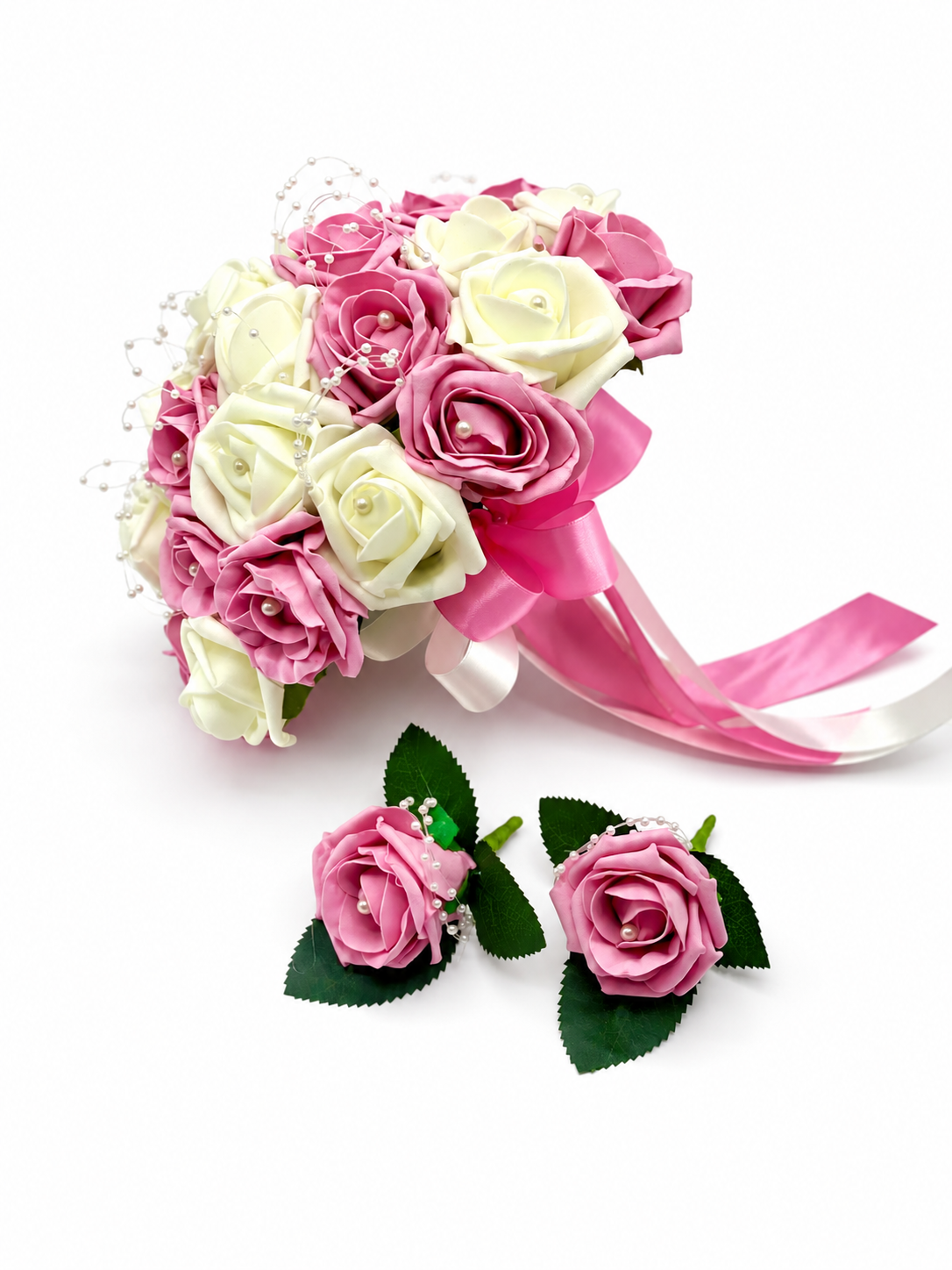 Pink and ivory rose bridal bouquet with matching buttonholes and soft shadows
